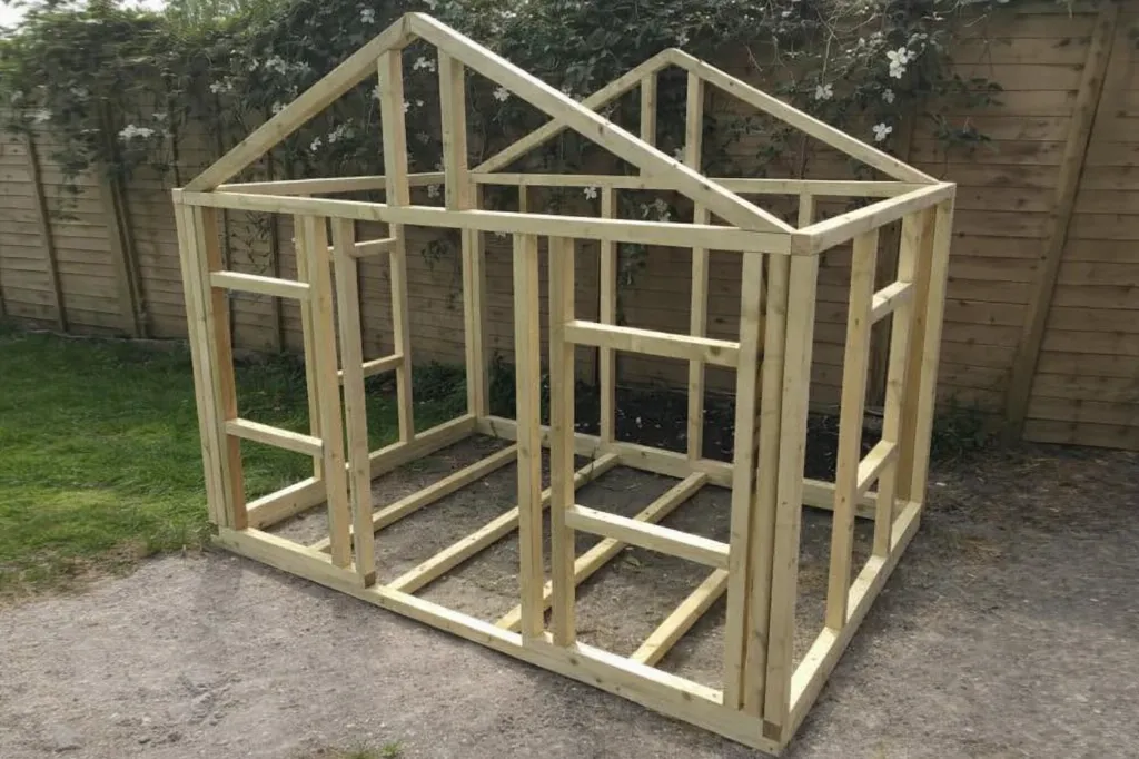 Huisje gemaakt van vuren regels de vier keien.webp